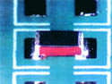 Light micrograph of 1206 solder joints on board #1, 12X